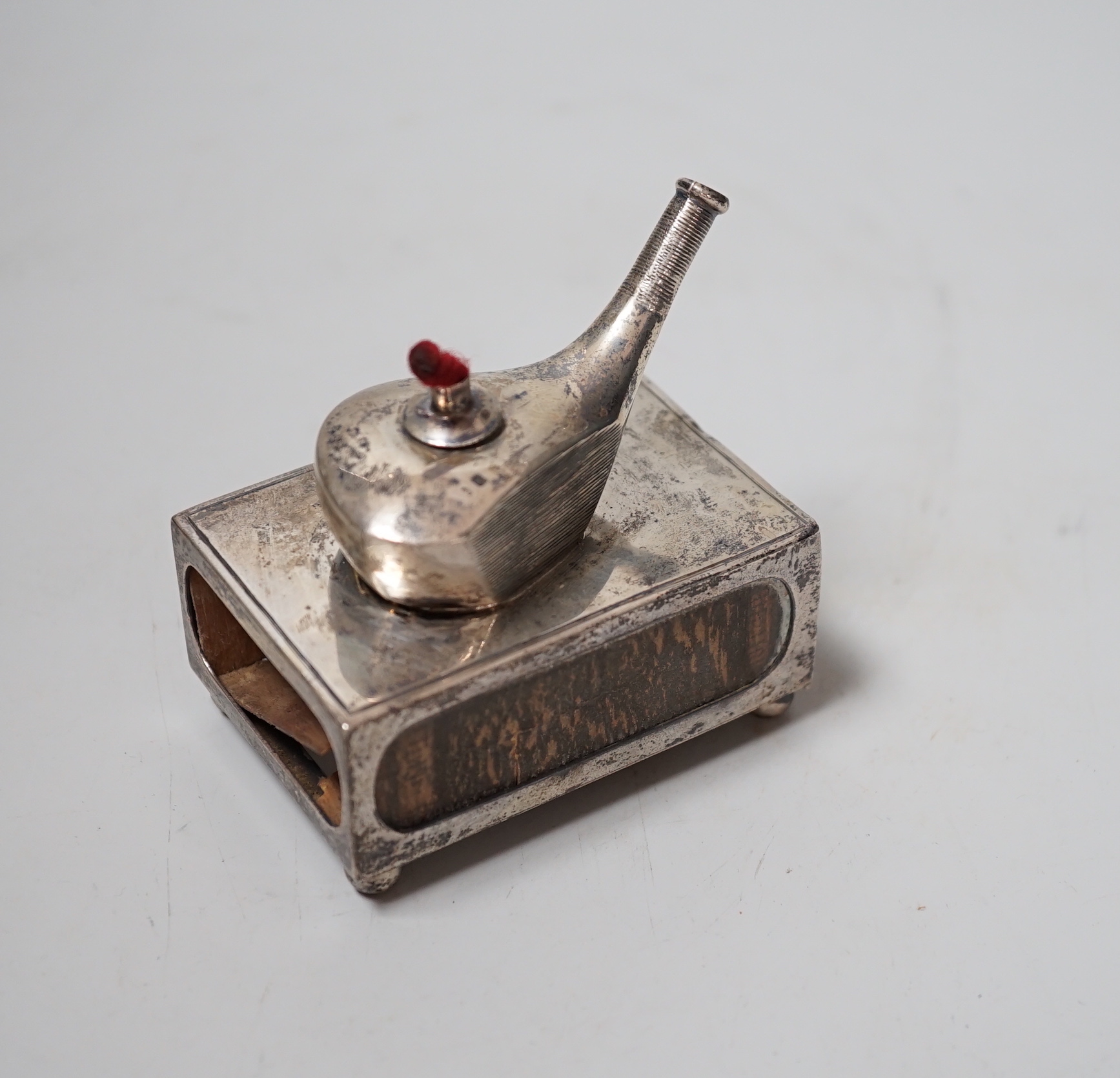 An unusual Edwardian silver matchbox sleeve, surmounted with a lamp shaped perpetual lighter, Crisford & Norris, Birmingham, 1908, 74mm.